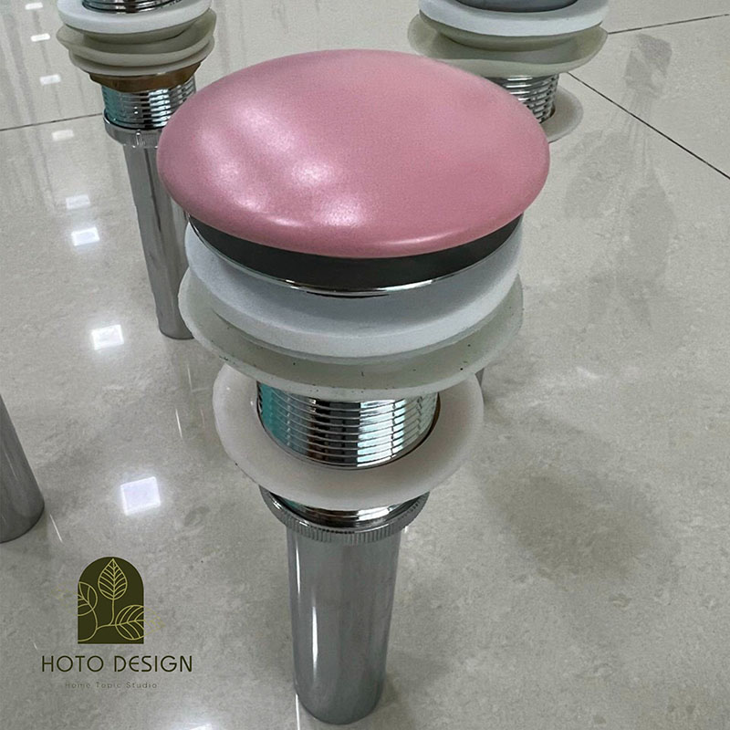 Bộ xả lavabo bằng đồng màu hồng.