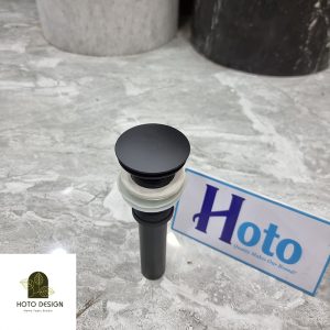 Đầu xả lavabo bằng đồng màu đen mờ.