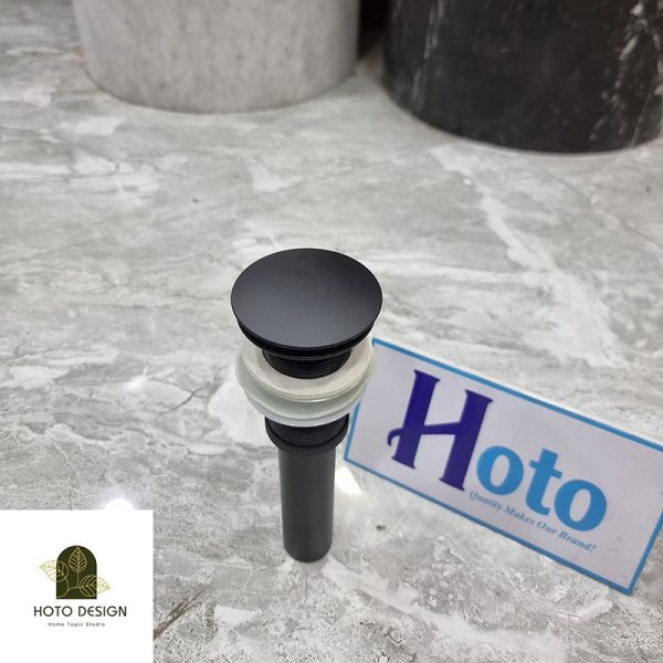 Đầu xả lavabo bằng đồng màu đen mờ.